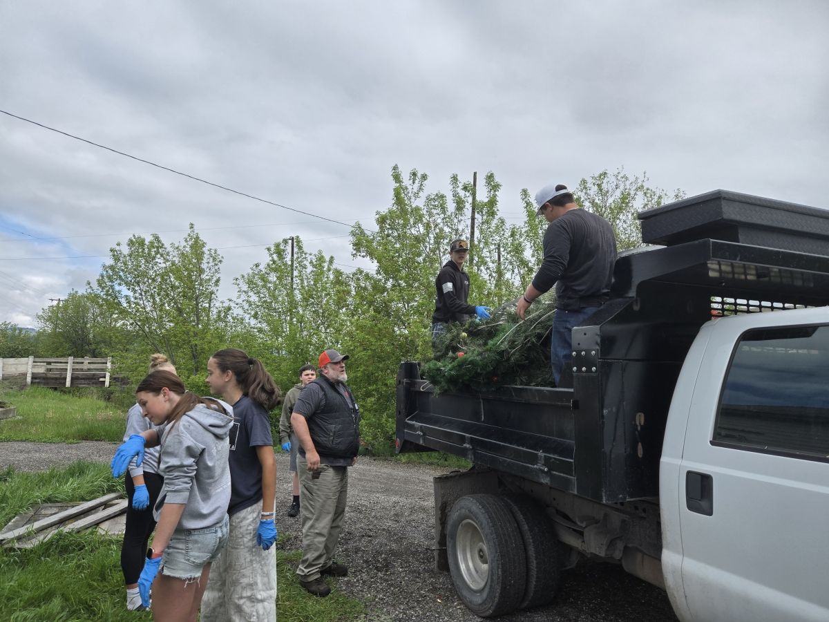 students loading old decorations onto truck